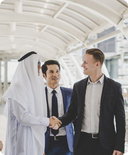 Professional attestation services in Dubai – business handshake between expat and UAE national symbolising trust, legalisation, and certificate attestation for work, study, and business