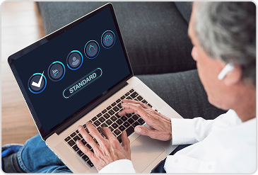 Person using laptop for Ministry of Education verification of school transfer certificate